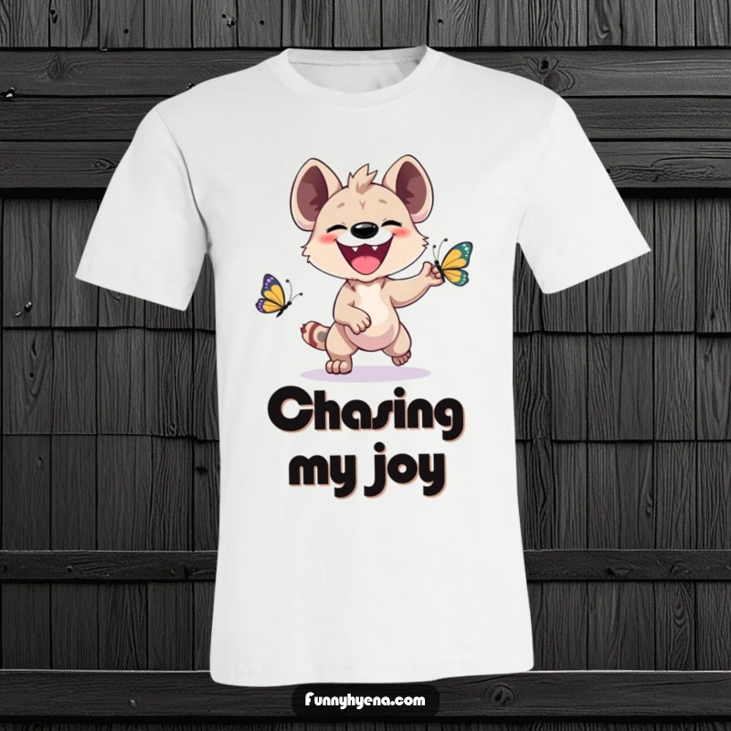 Funny Kawaii Hyena T-Shirt: A whimsical hyena grins widely while playfully chasing a vibrant butterfly, showcasing pure delight.